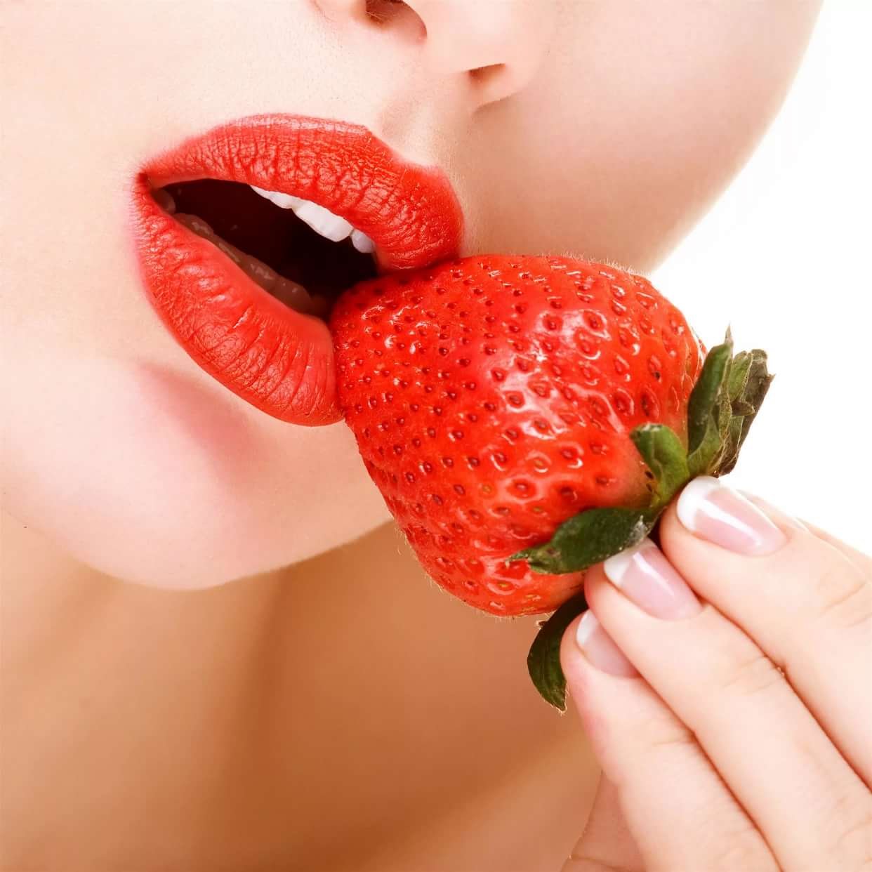 Sexy Woman Eating Strawberry Stock Photo